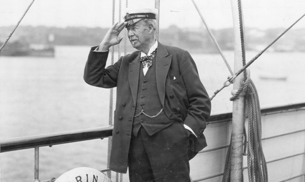 Original Caption: Newport, RI- Sir Thomas Lipton and his Challenger, Newport bound. Photo shows Sir Thomas Lipton aboard his yacht, Erin, which conveyed the Shamrock V to Newport, RI, the scene of her trials and eventual meeting with the United States yacht in the American Cup Match. Photo shows Lipton on deck saluting. Undated photograph circa 1920.